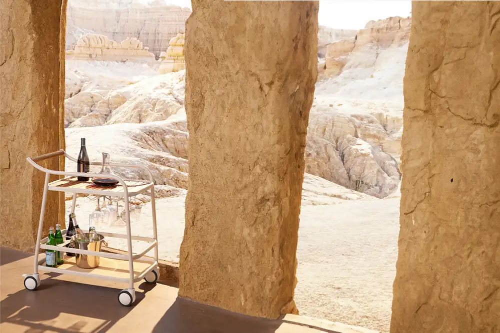 Stylish outdoor bar cart with wheels, featuring a durable metal frame, spacious shelves for drinks and accessories, and a sleek modern design, perfect for entertaining in outdoor spaces