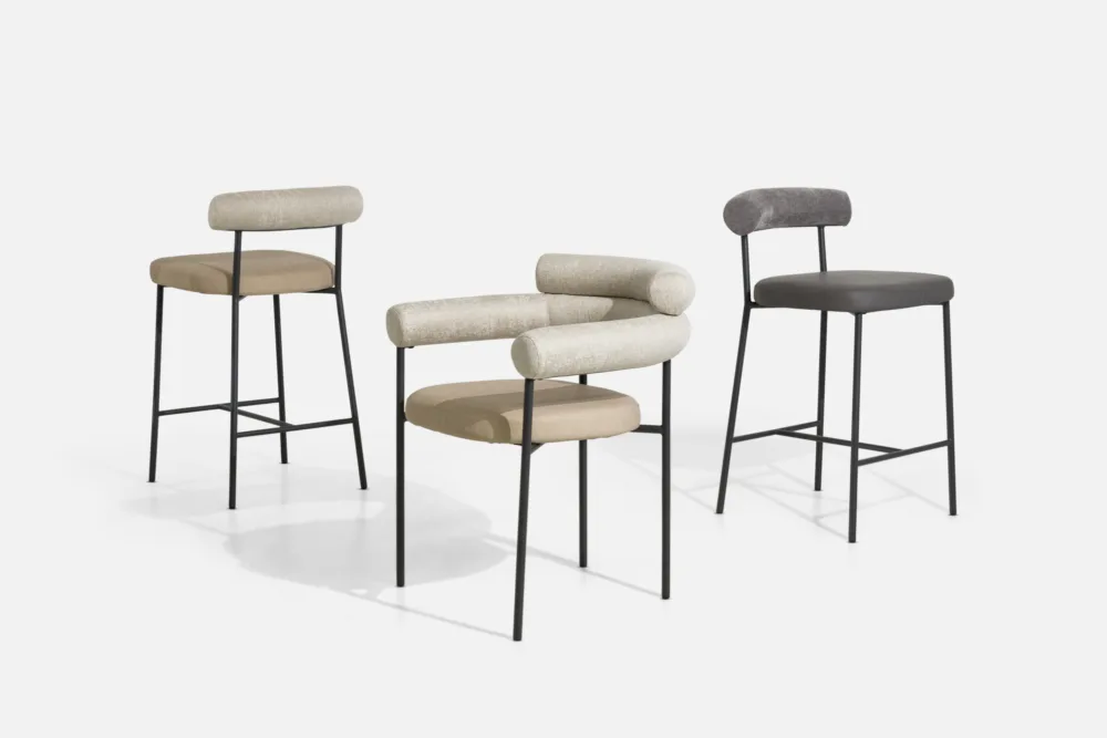 “Bradfords contemporary barstool with curved upholstered backrest, padded seat, and slender black metal frame – modern seating for kitchen islands and breakfast bar