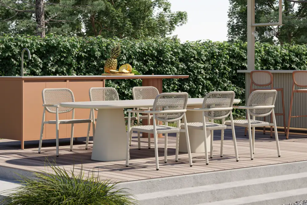 Modern outdoor dining table available in sand and black, featuring a sleek, rounded rectangular top and sturdy sculptural pedestal legs, perfect for stylish outdoor dining areas